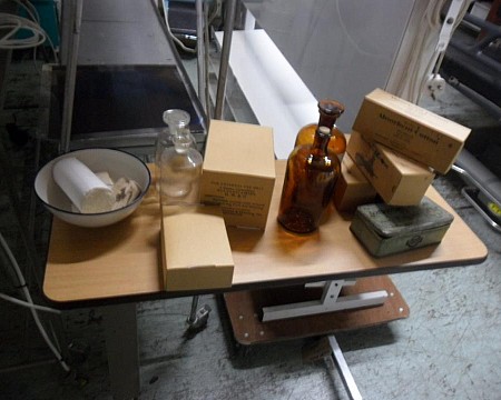 X4 Misc period bottles 6 boxes bandages and a green container 